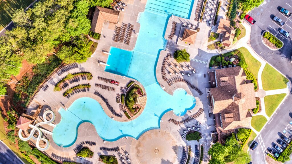 Aerial drone photo of the BridgeMill Pool and pool deck area looking directly down at the pool